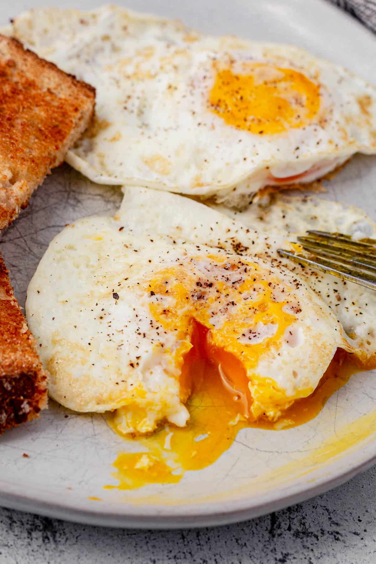 over-medium egg with a bite cut out