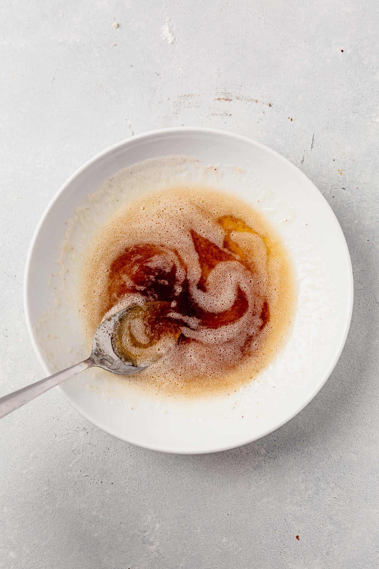 brown butter in a bowl with a spoon