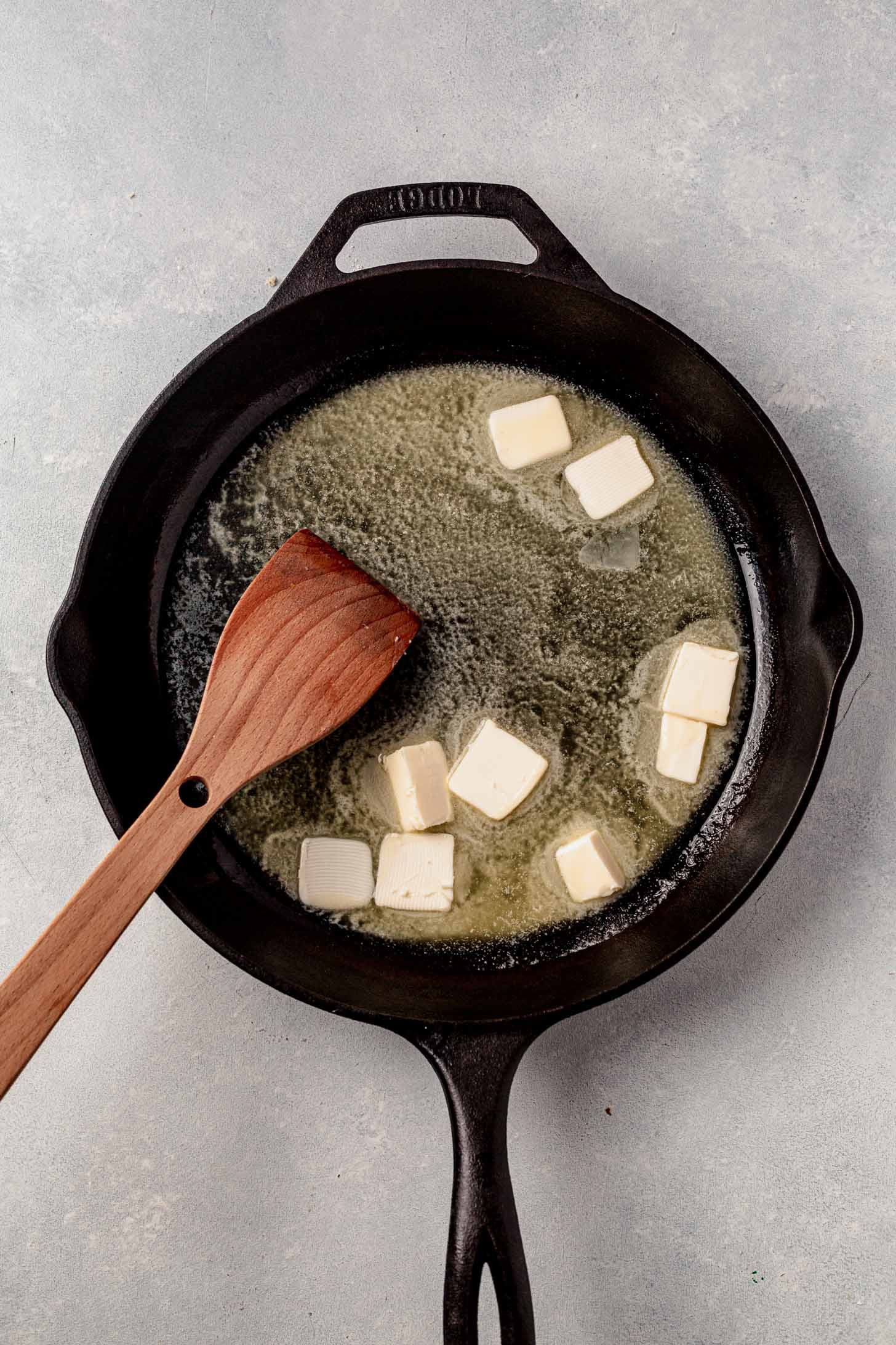 cubes of butter melted in a pan