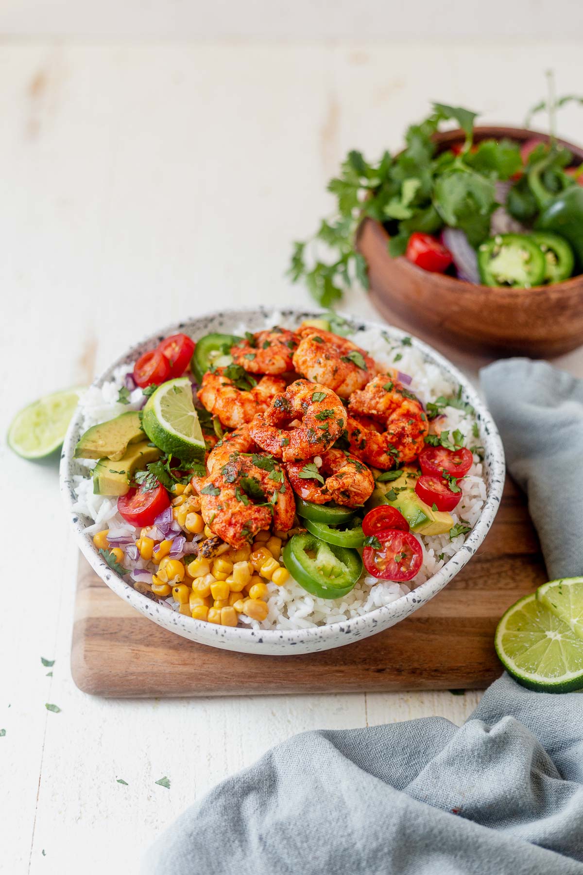 shrimp bowl with cilantro lime rice, corn, tomatoes, jalapeno and cilantro