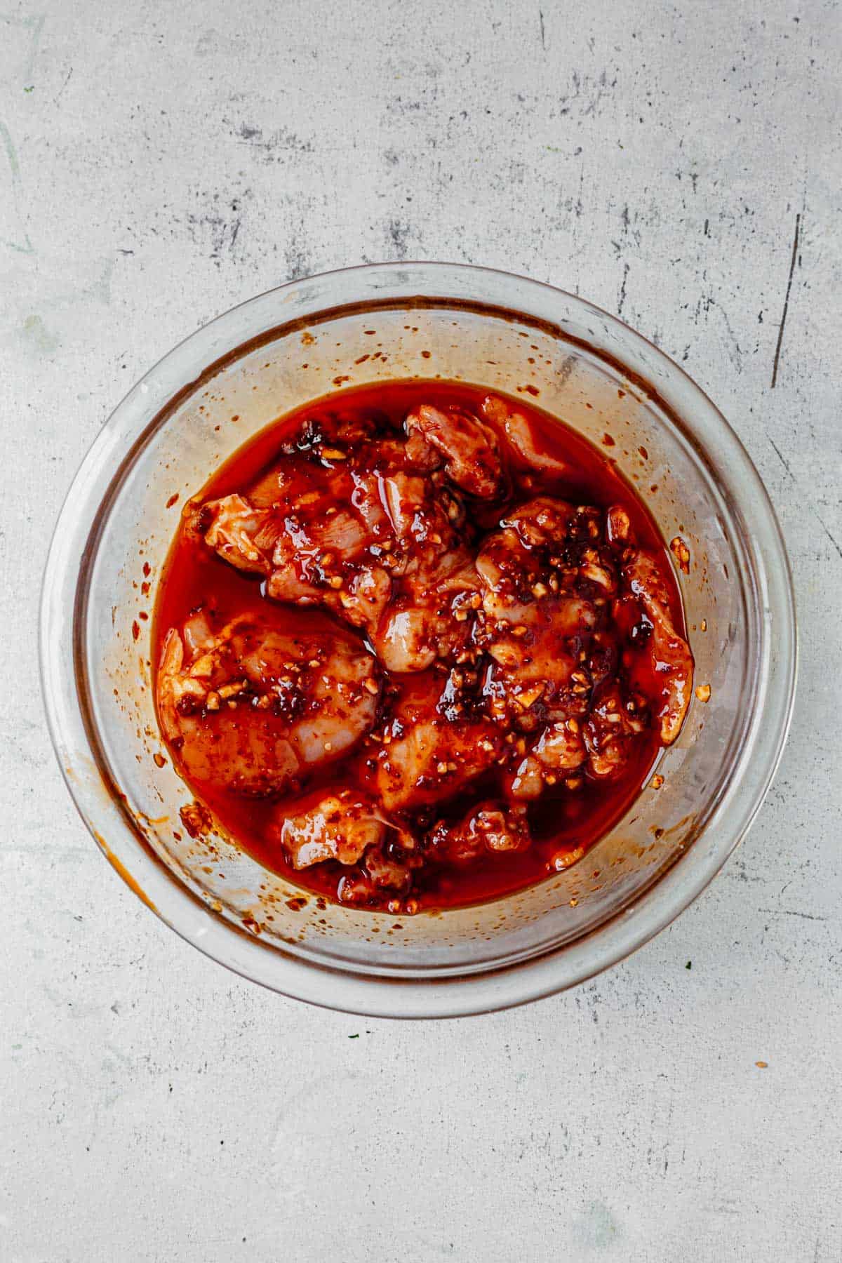 chicken marinating in harissa