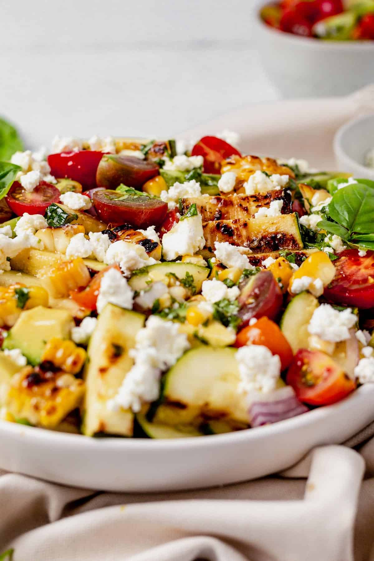 grilled zucchini salad in a serving bowl