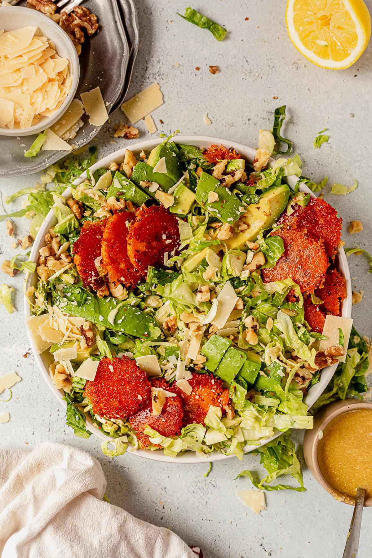 brussels sprout caesar salad with avocado and sweet potatoes