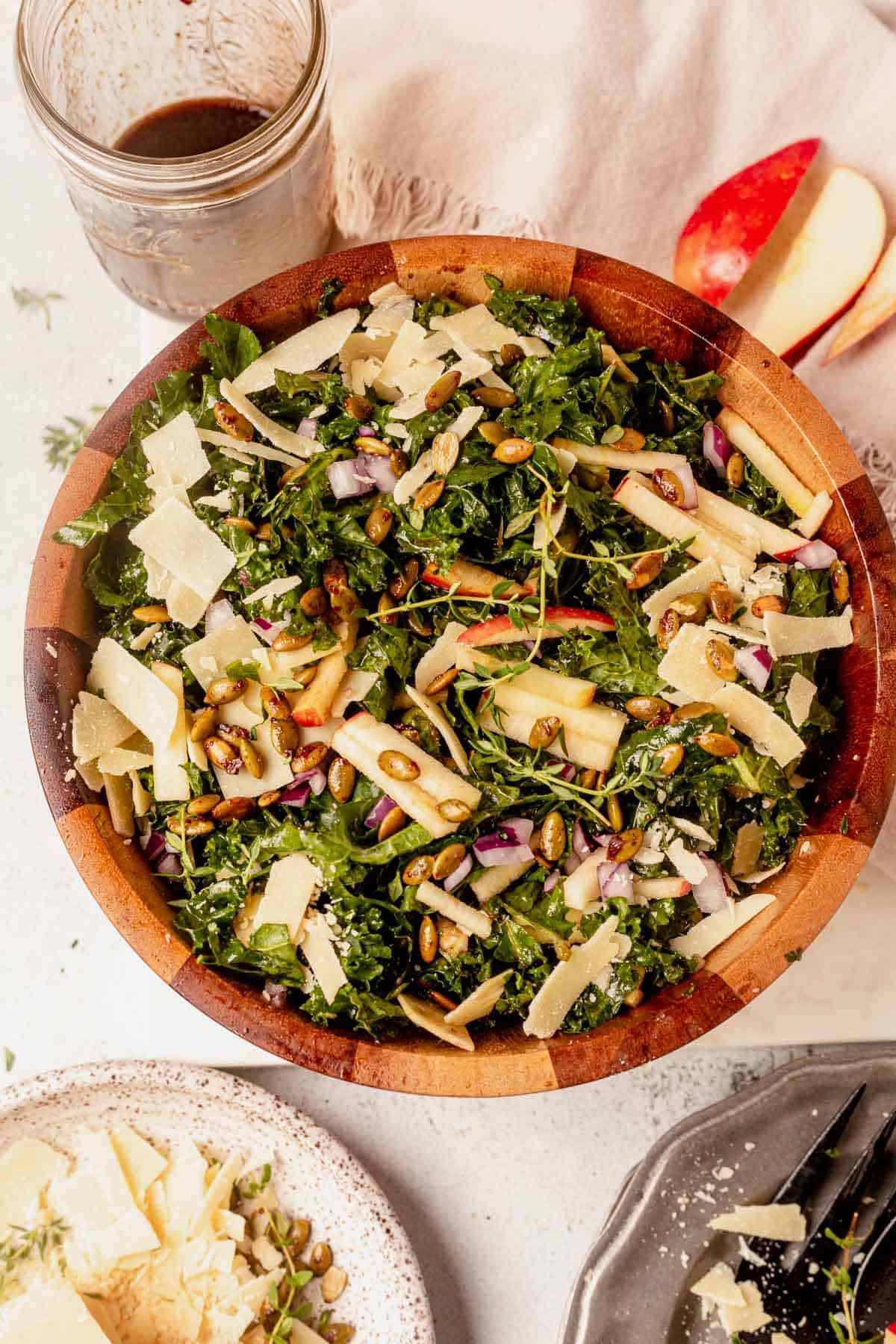 kale apple salad in a wooden bowl