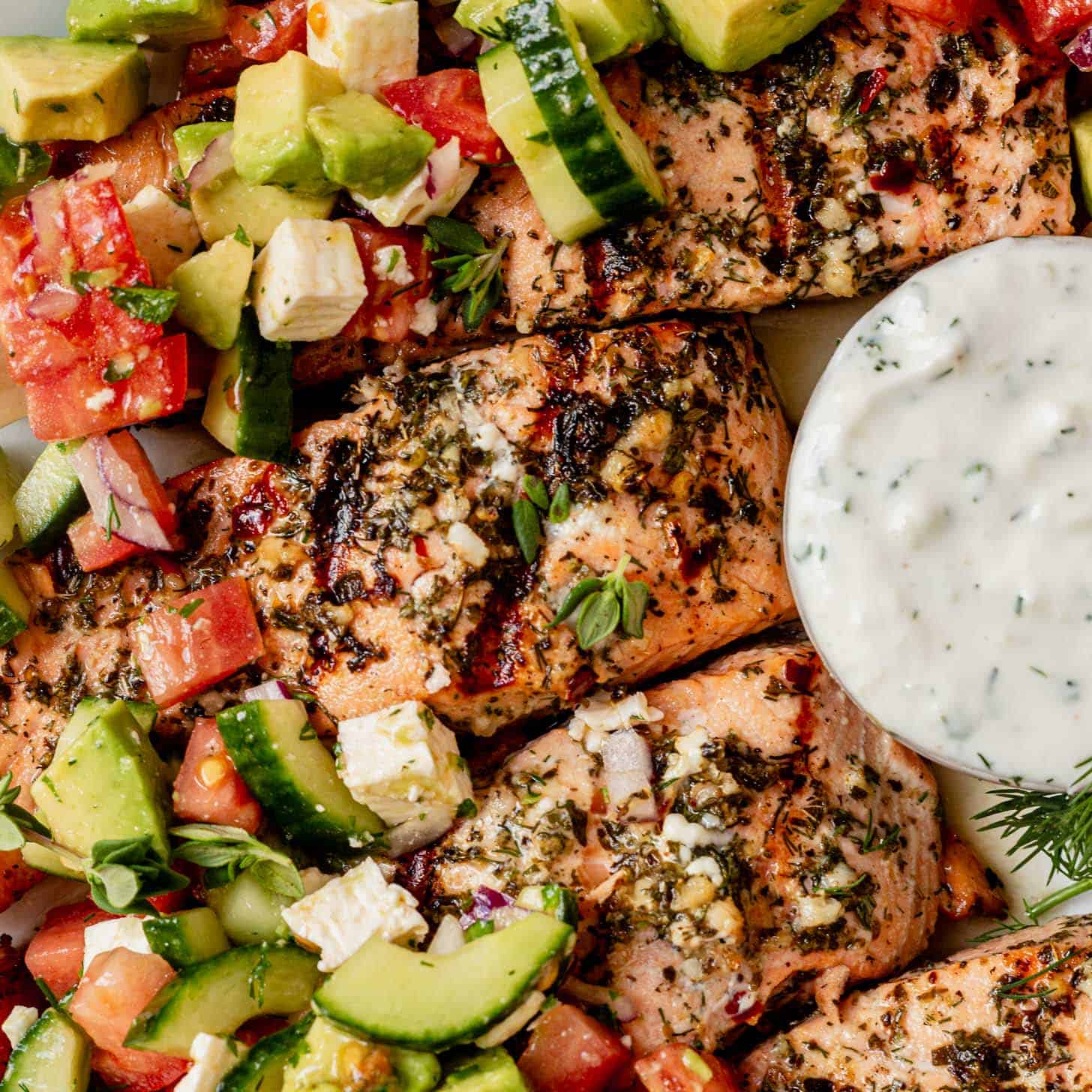 grilled greek salmon topped with cucumber, avocado, and feta