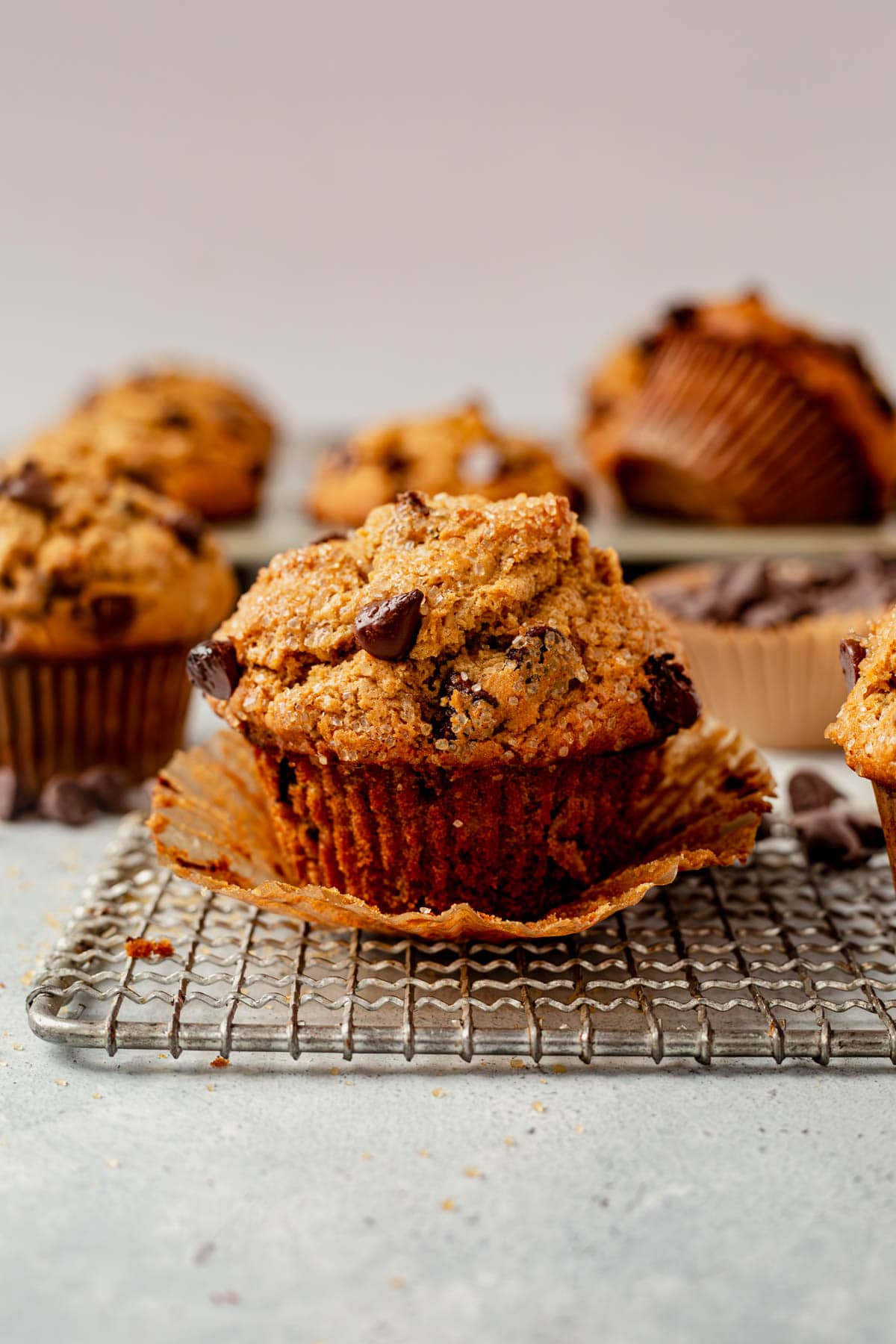 the paper liner taken off of an oatmeal chocolate chip muffin