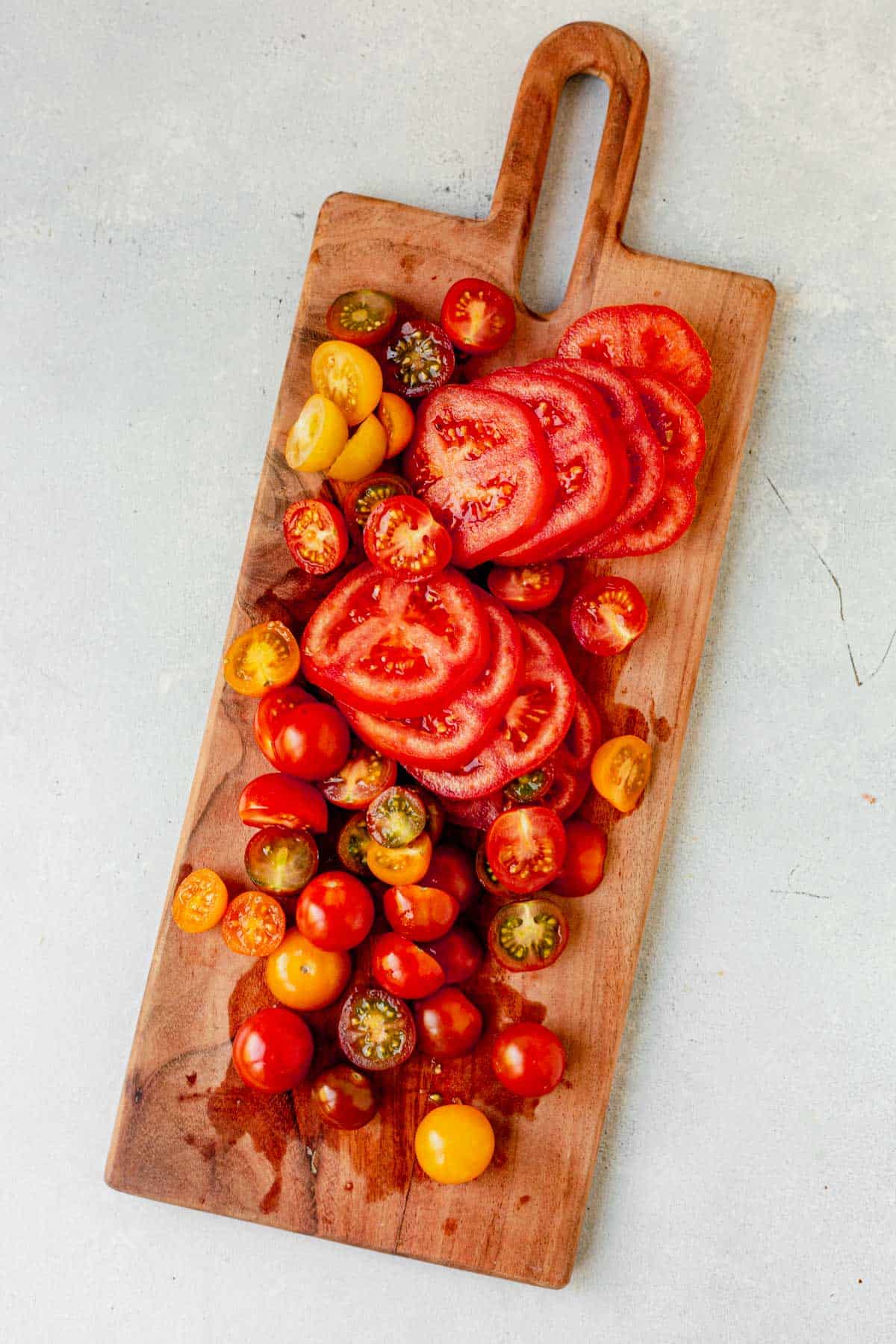 sliced tomatoes on a cutting board