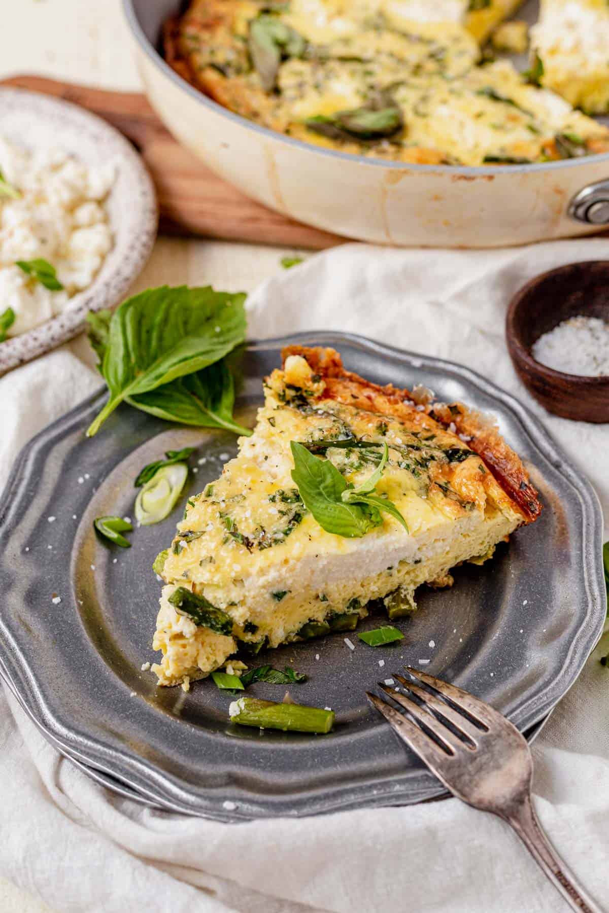 a piece of asparagus and cheese frittata on a olate