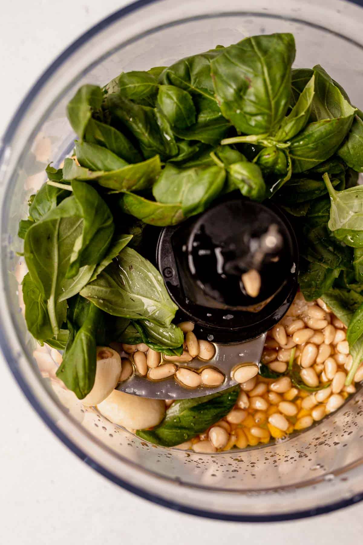 basil pesto ingredients in a food processor