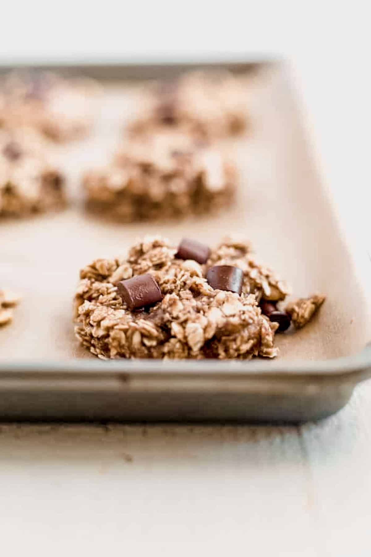 banana oatmeal chocolate chip cookies on a baking sheet