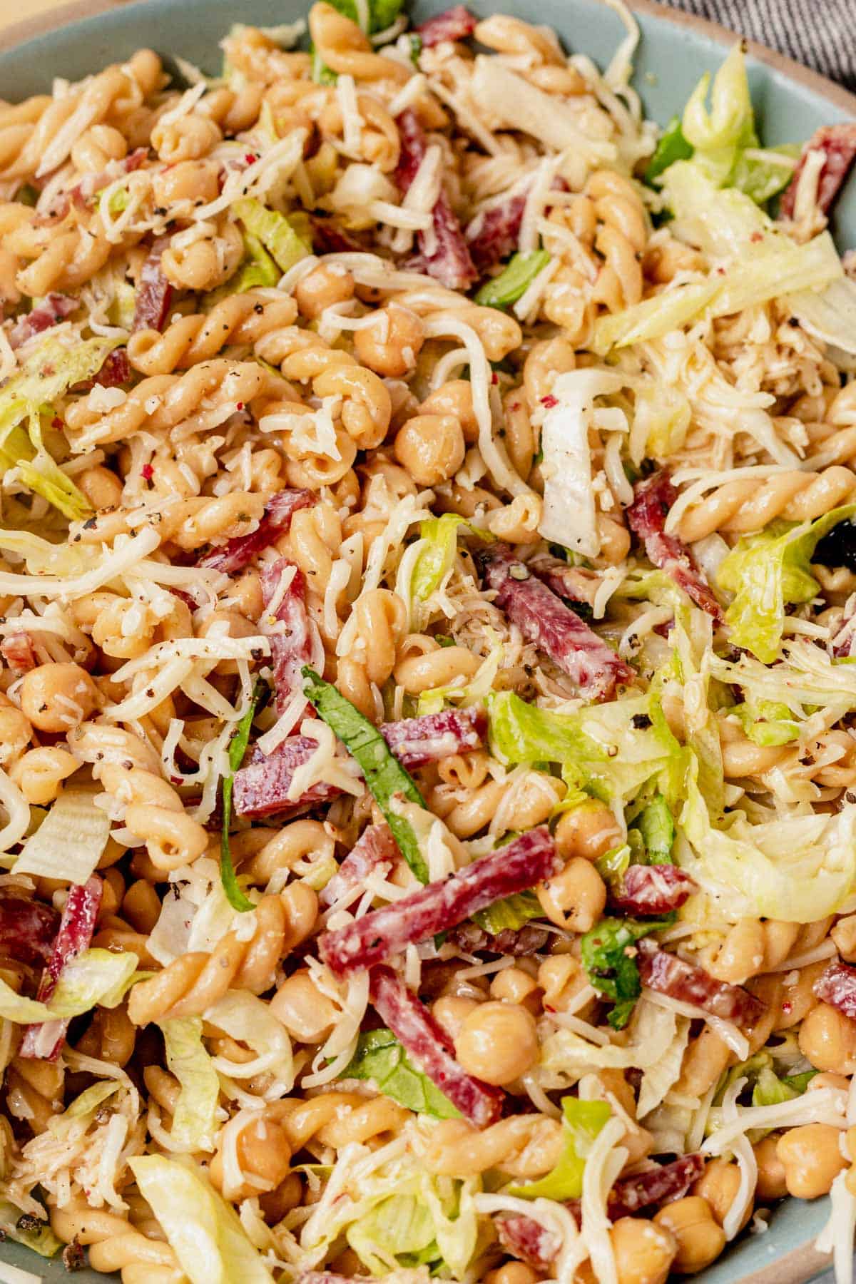 Italian pasta salad with salami in a bowl