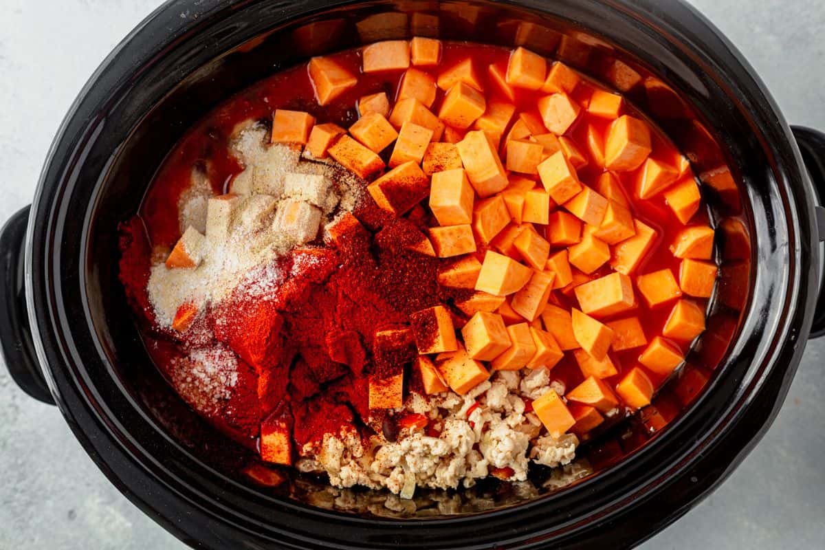 sweet potato chicken chili ingredients in a crock pot