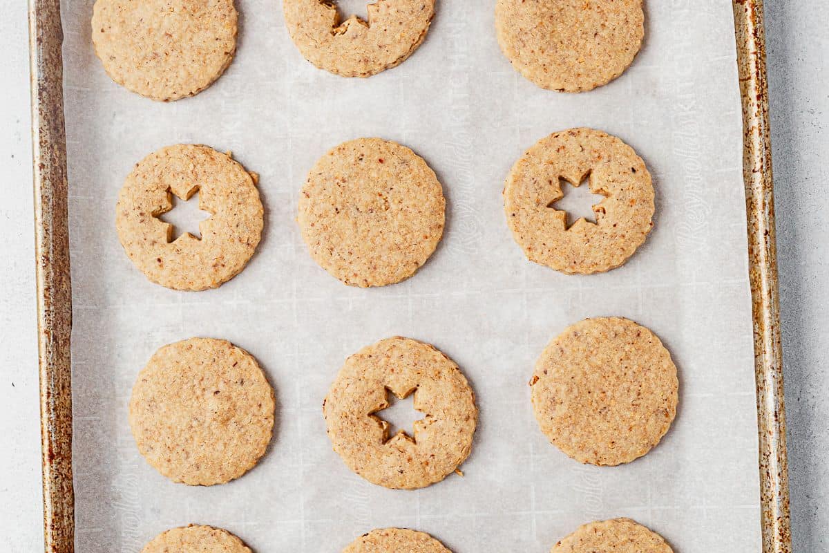 freshly baked hazelnut shortbread cookies on a baking sheet