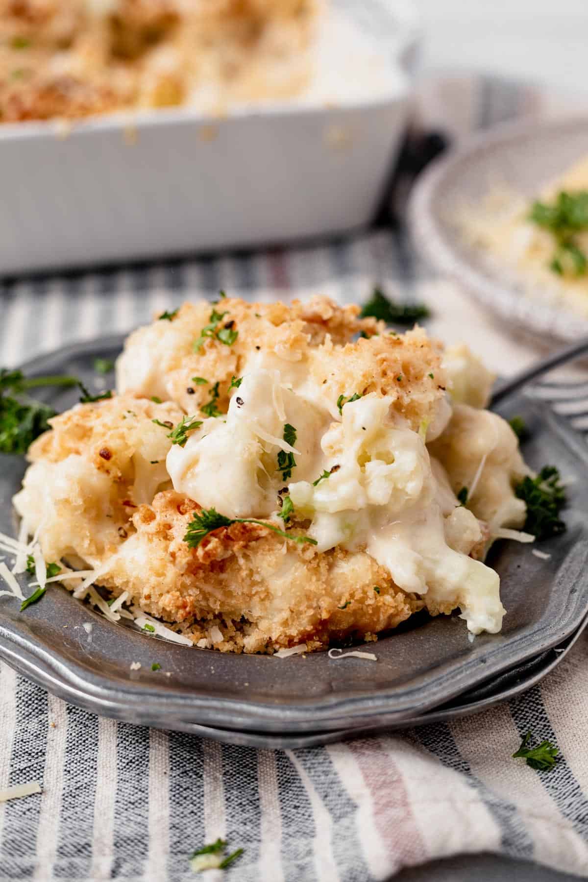 cauliflower gratin on a plate with fresh parsley