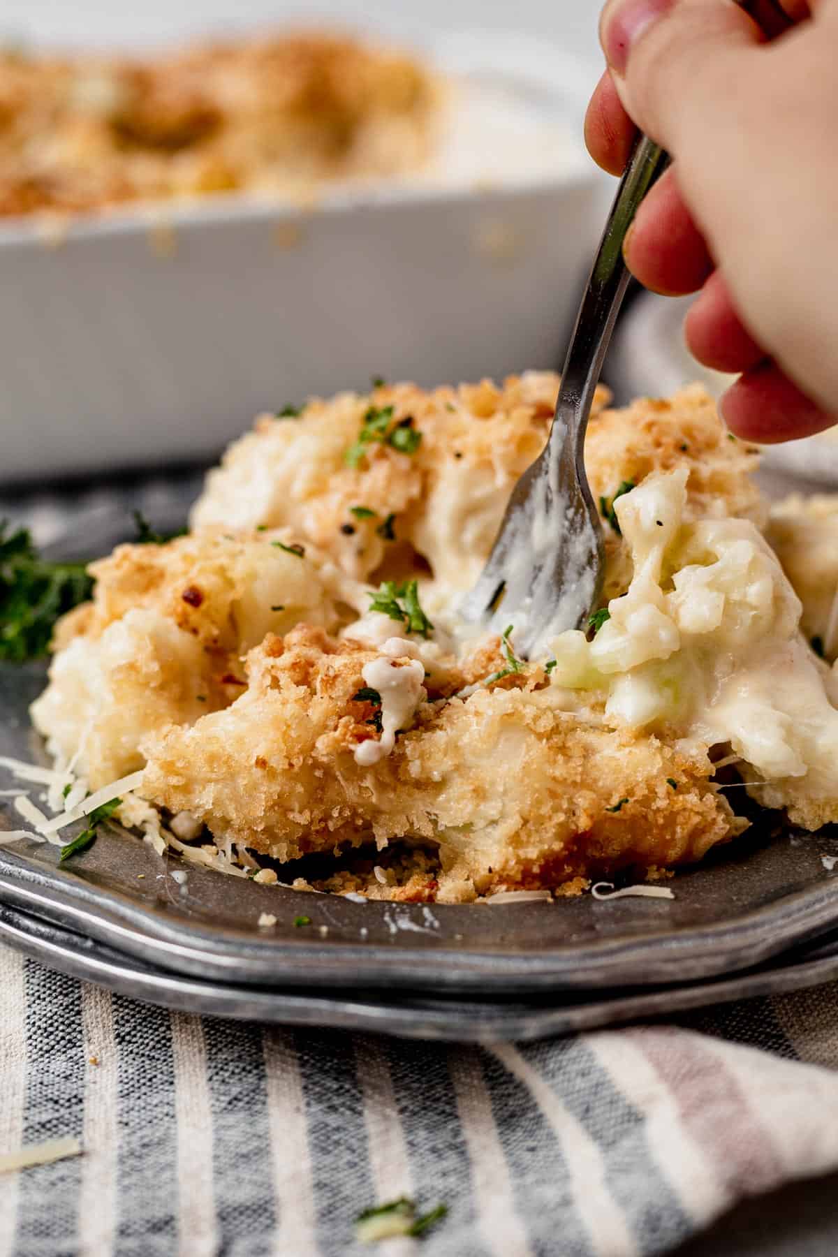 cauliflower au gratin on a silver serving plate