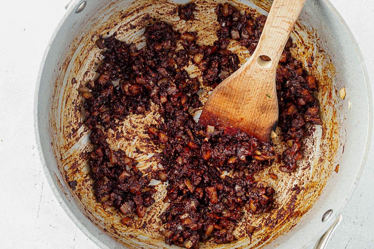 onion, garlic, and chili spices mixed in a pot