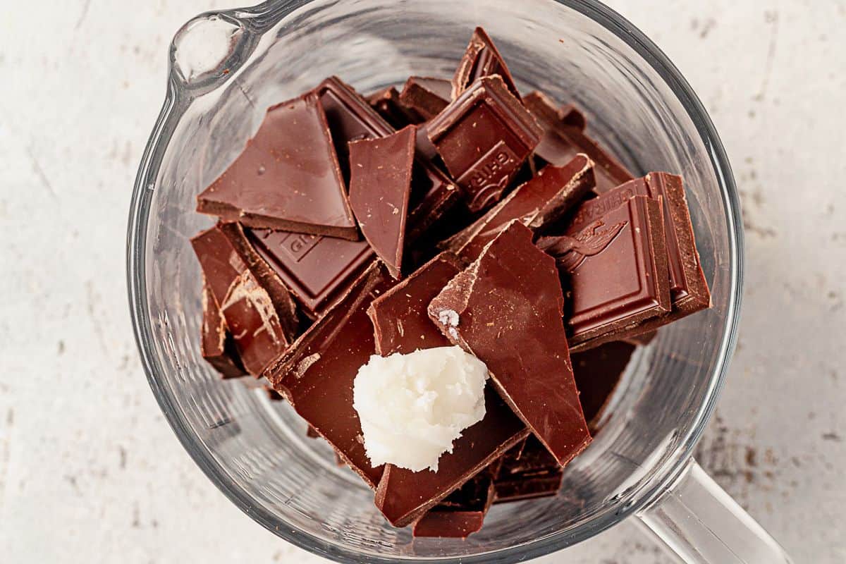 broken pieces of chocolate and coconut oil in a bowl