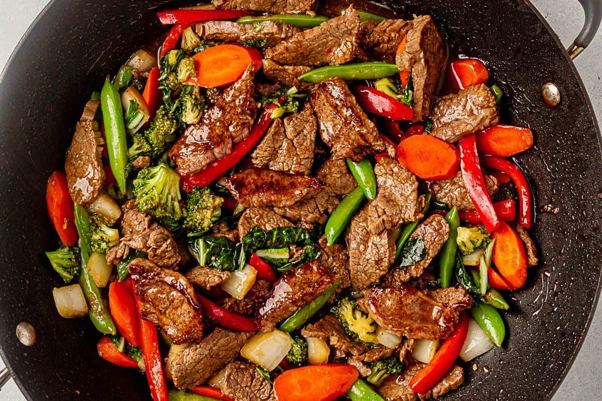 flank steak stir fry in a wok