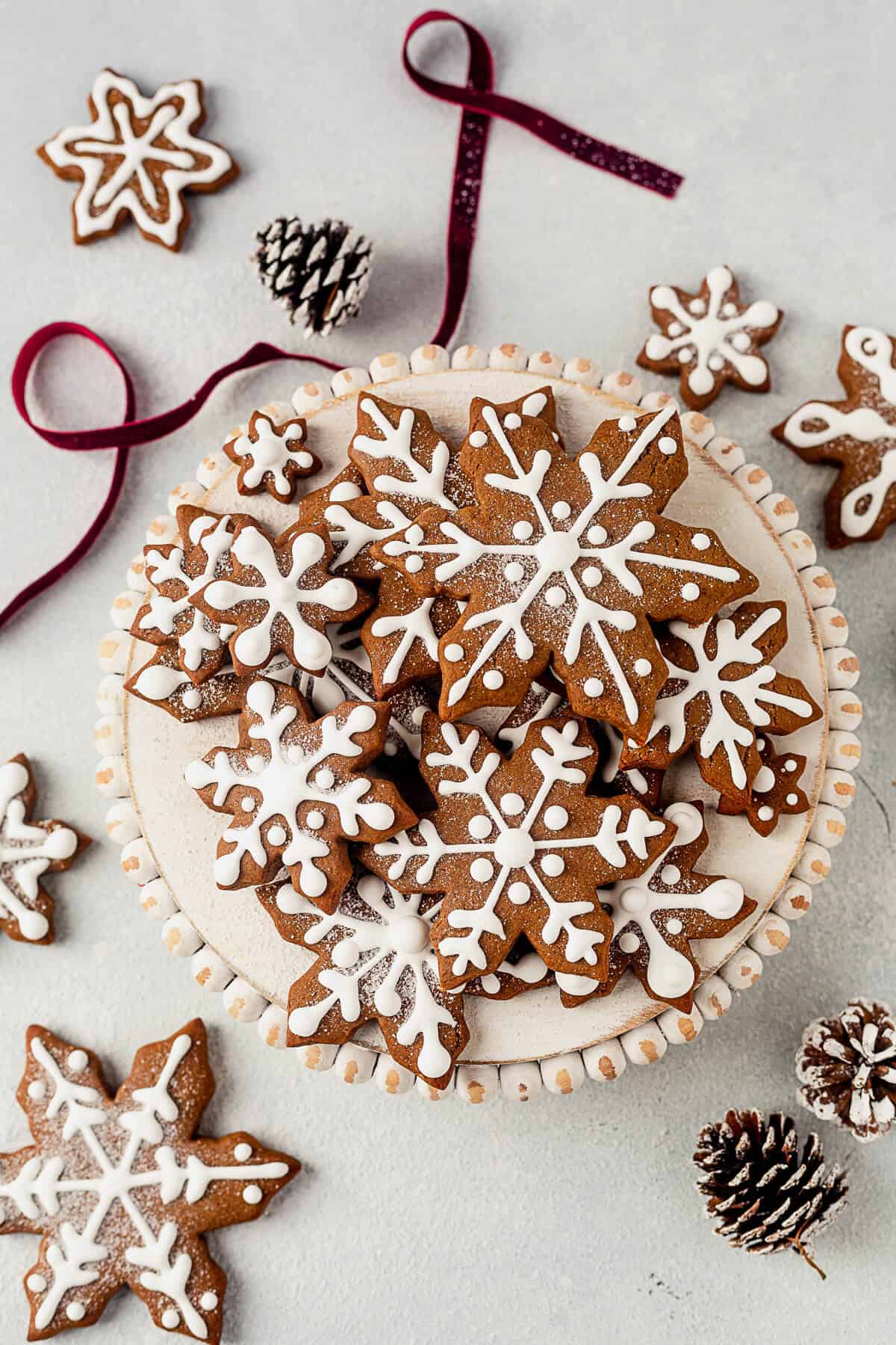 a plate of gingerbread snowflake cookies