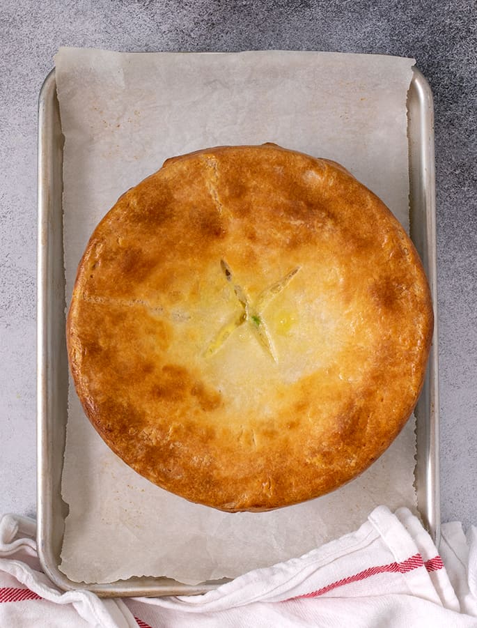 Baked pie crust on round white casserole dish