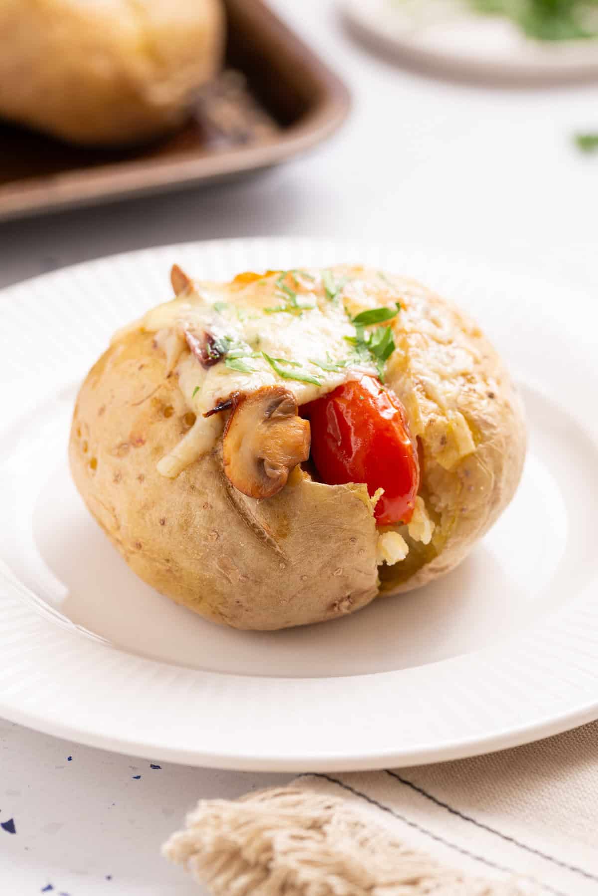 A close-up image of stuffed baked potatoes.