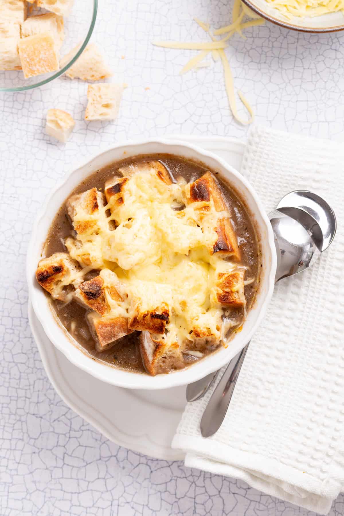 An overhead image of vegetarian French onion soup, ready to be served.